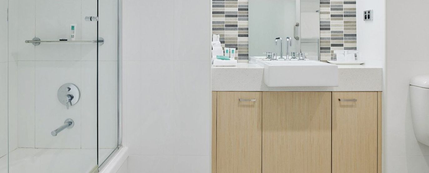Deluxe Suite bathroom with premium fittings at The Ville